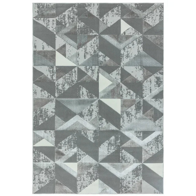 Grey geometric pattern rug with abstract triangles and textured detailing