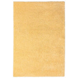 Rectangular beige shaggy rug with soft textured pile