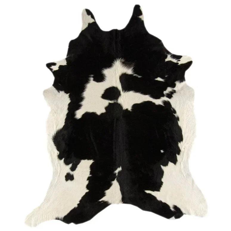 Black and white cowhide rug with natural irregular pattern, top angle view
