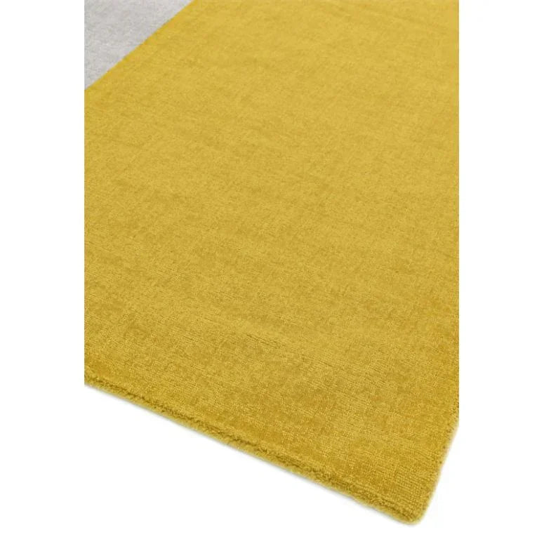 Yellow area rug with soft texture and clean edge, modern flooring accent closeup