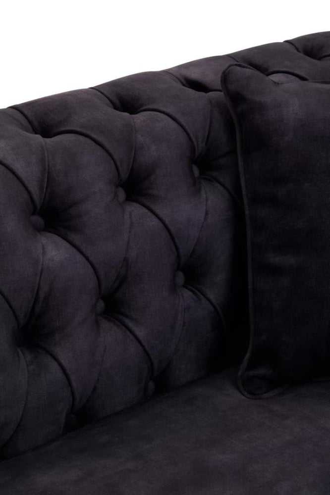Three-seat sofa upholstered in grey velvet featuring a tufted backrest and a matching cushion, showcasing a luxurious and modern design