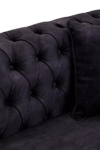 Three-seat sofa upholstered in grey velvet featuring a tufted backrest and a matching cushion, showcasing a luxurious and modern design