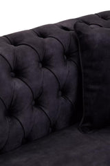 Three-seat sofa upholstered in grey velvet featuring a tufted backrest and a matching cushion, showcasing a luxurious and modern design