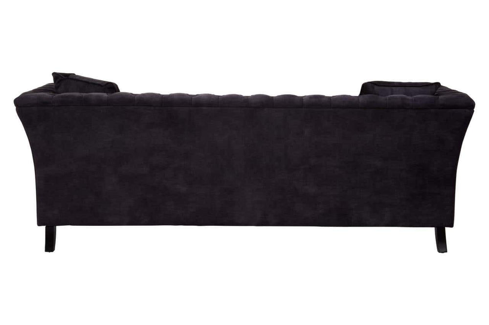 Three-seat sofa upholstered in grey velvet with a sleek, curved backrest and subtle tufting details. The sofa features tapered black legs, providing a modern and elegant look suitable for various interior styles