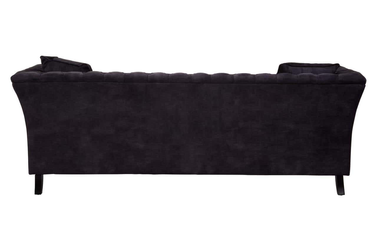 Three-seat sofa upholstered in grey velvet with a sleek, curved backrest and subtle tufting details. The sofa features tapered black legs, providing a modern and elegant look suitable for various interior styles