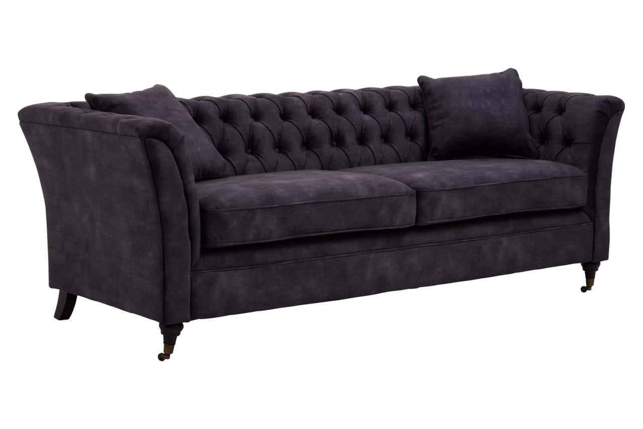 Three-seat sofa upholstered in grey velvet with a tufted backrest and two matching cushions, featuring elegant curved arms and tapered wooden legs