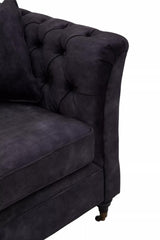 Grey velvet three-seat sofa featuring a tufted design on the backrest and armrest, with elegant curved lines and wooden legs. The fabric has a soft, plush texture, adding a touch of sophistication to any living space
