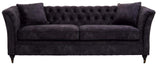 Three-seat sofa upholstered in grey velvet with a tufted backrest and two matching cushions, featuring elegant curved arms and tapered wooden legs