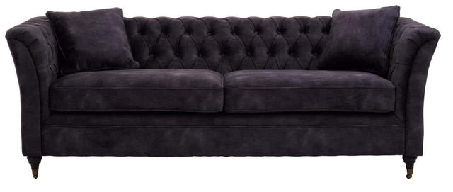 Three-seat sofa upholstered in grey velvet with a tufted backrest and two matching cushions, featuring elegant curved arms and tapered wooden legs