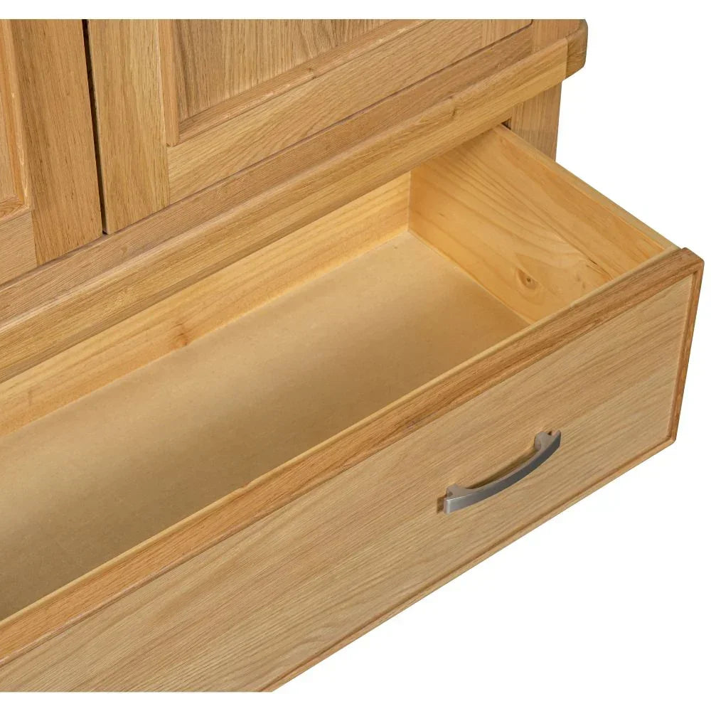 Closeup of oak 2-door wardrobe drawer with metal handle, open and empty