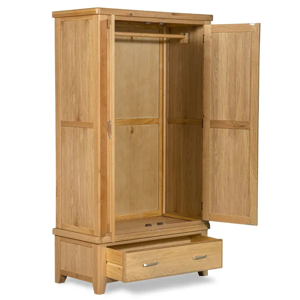 Oak 2-door wardrobe open showing hanging rail and single lower storage drawer