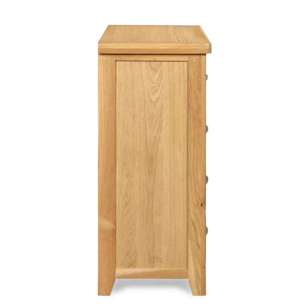 Side view of oak chest of drawers showing smooth wood grain and clean lines