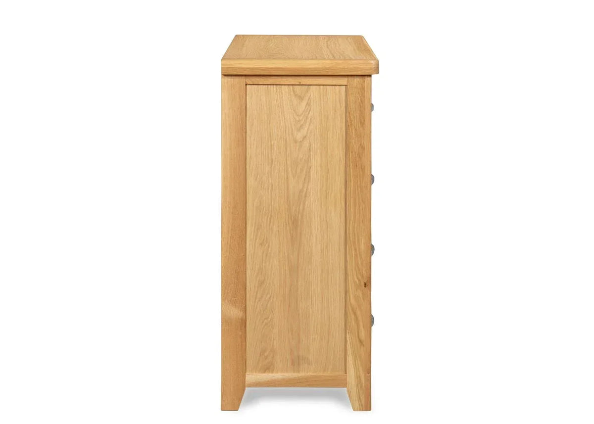 Side view of oak chest of drawers showing smooth wood grain and clean lines