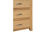 Oak chest of drawers lower section with three metal handles and natural wood grain finish
