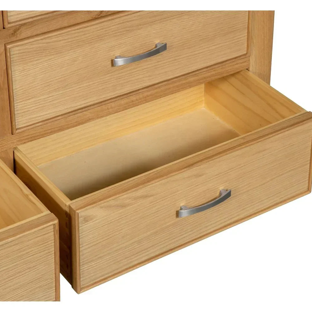 Sligo 6 drawer chest in light wood finish with bottom drawers open, silver handles visible
