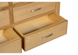 Sligo 6 drawer chest in light wood finish with bottom drawers open, silver handles visible