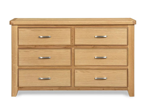 Oak 6 drawer chest with silver handles, wood grain finish, shown from the front
