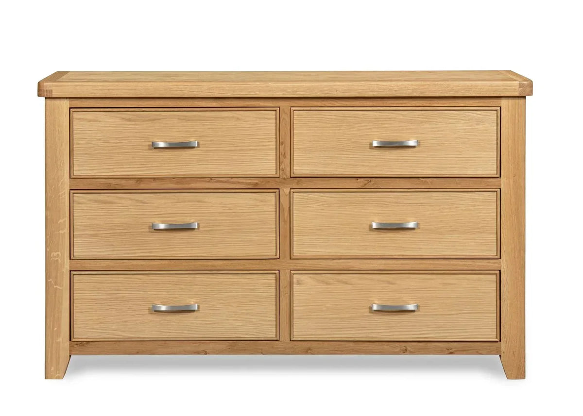 Oak 6 drawer chest with silver handles, wood grain finish, shown from the front