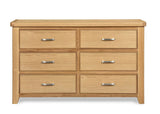 Oak 6 drawer chest with silver handles, wood grain finish, shown from the front