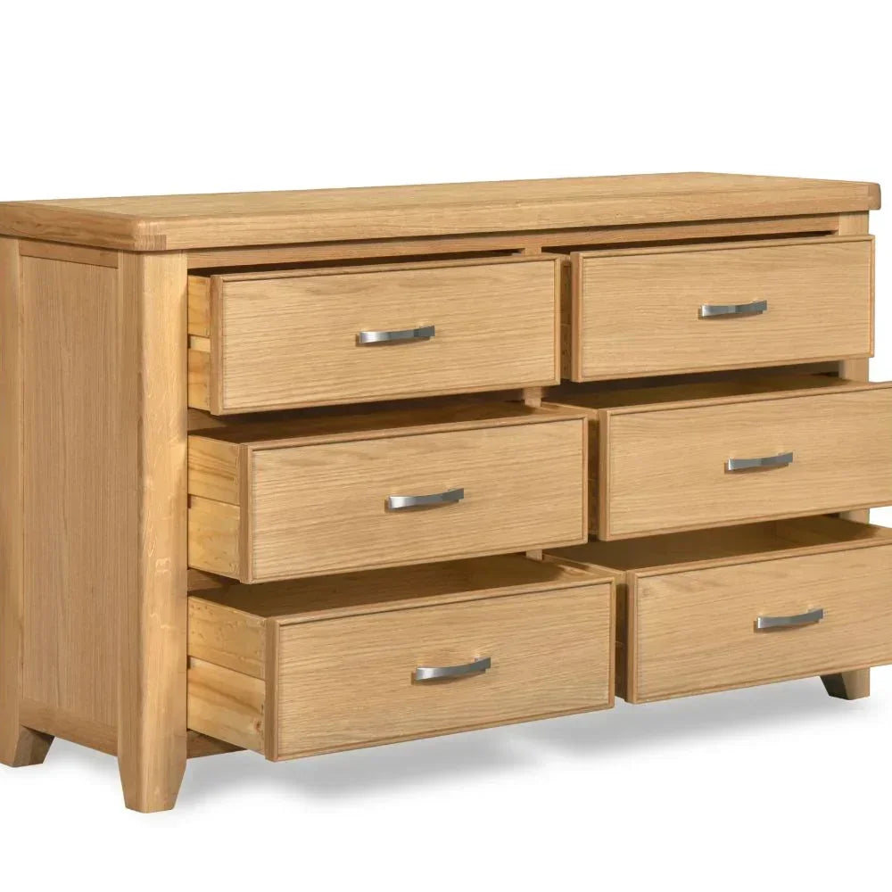 Oak 6 drawer chest with silver handles, all drawers open, side angle view