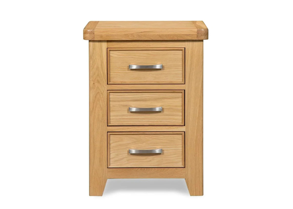 Oak bedside table with three drawers and silver handles, front view