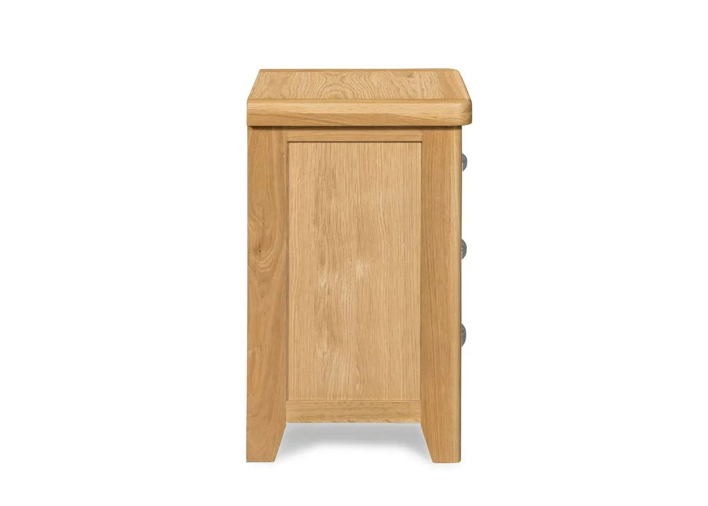 Side view of oak bedside table showing wood grain and panelled design