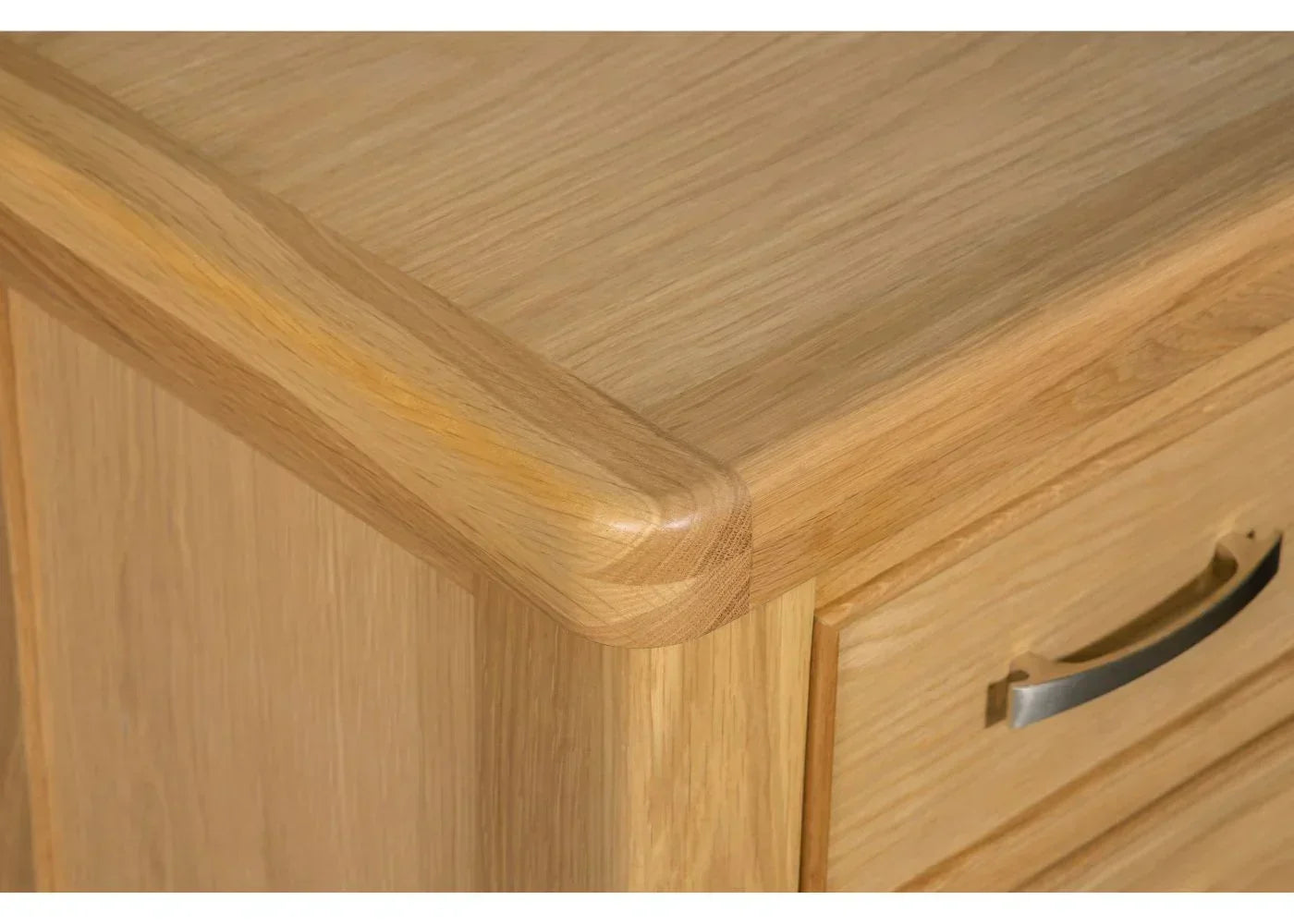 Oak bedside table with smooth rounded corner and brushed metal drawer handle