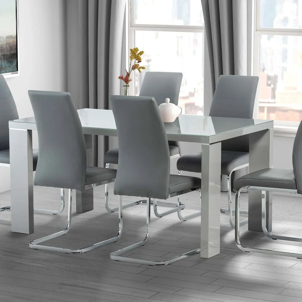 Grey dining table set with six chrome frame chairs in a modern dining room