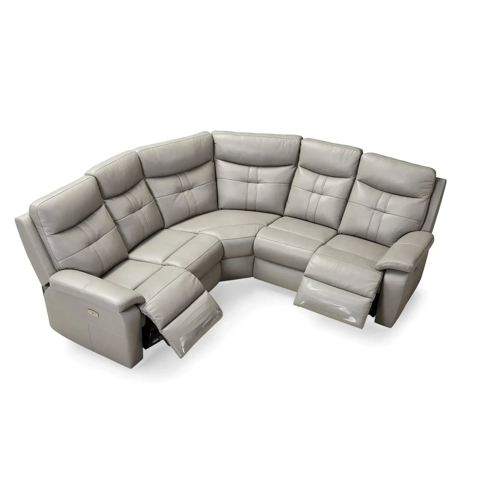 Grey corner reclining sofa with padded seats and high backs, two footrests extended