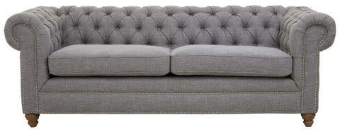 Three-seat sofa upholstered in grey linen with a tufted backrest and rolled arms, featuring wooden legs in a light finish