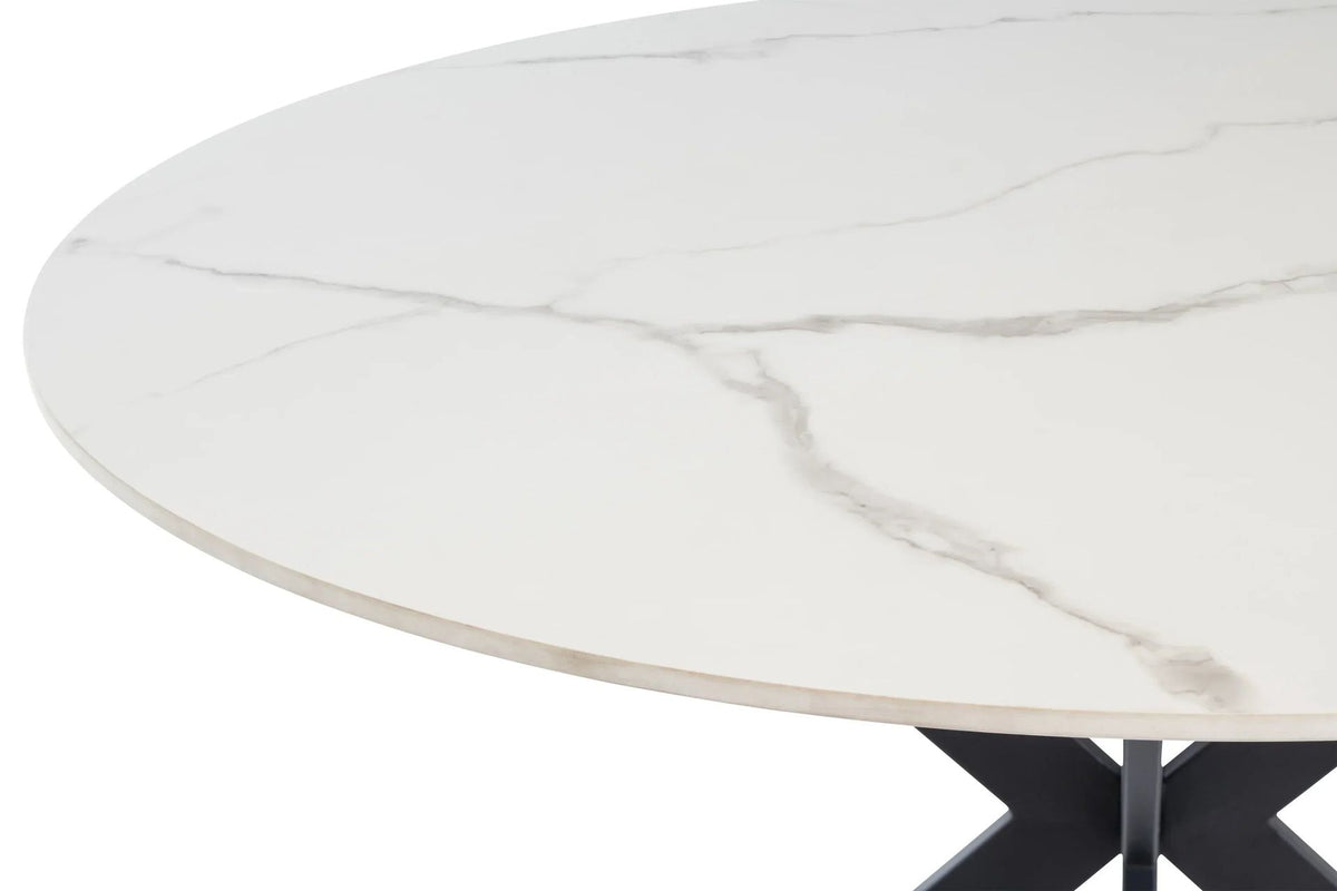 Close-up of white marble-effect table top showing grey veining