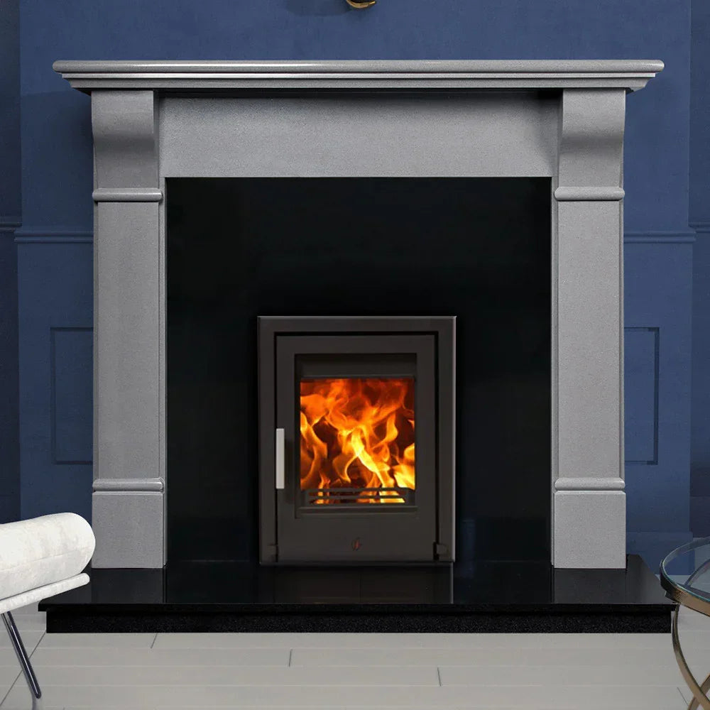 Polished Luna grey fireplace surround with fire insert against navy wall
