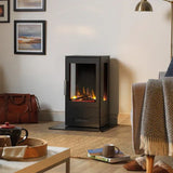Black freestanding electric fire heater with realistic flame effect in modern living room