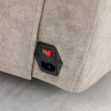 Close up of fabric recliner sofa power switch and plug socket panel