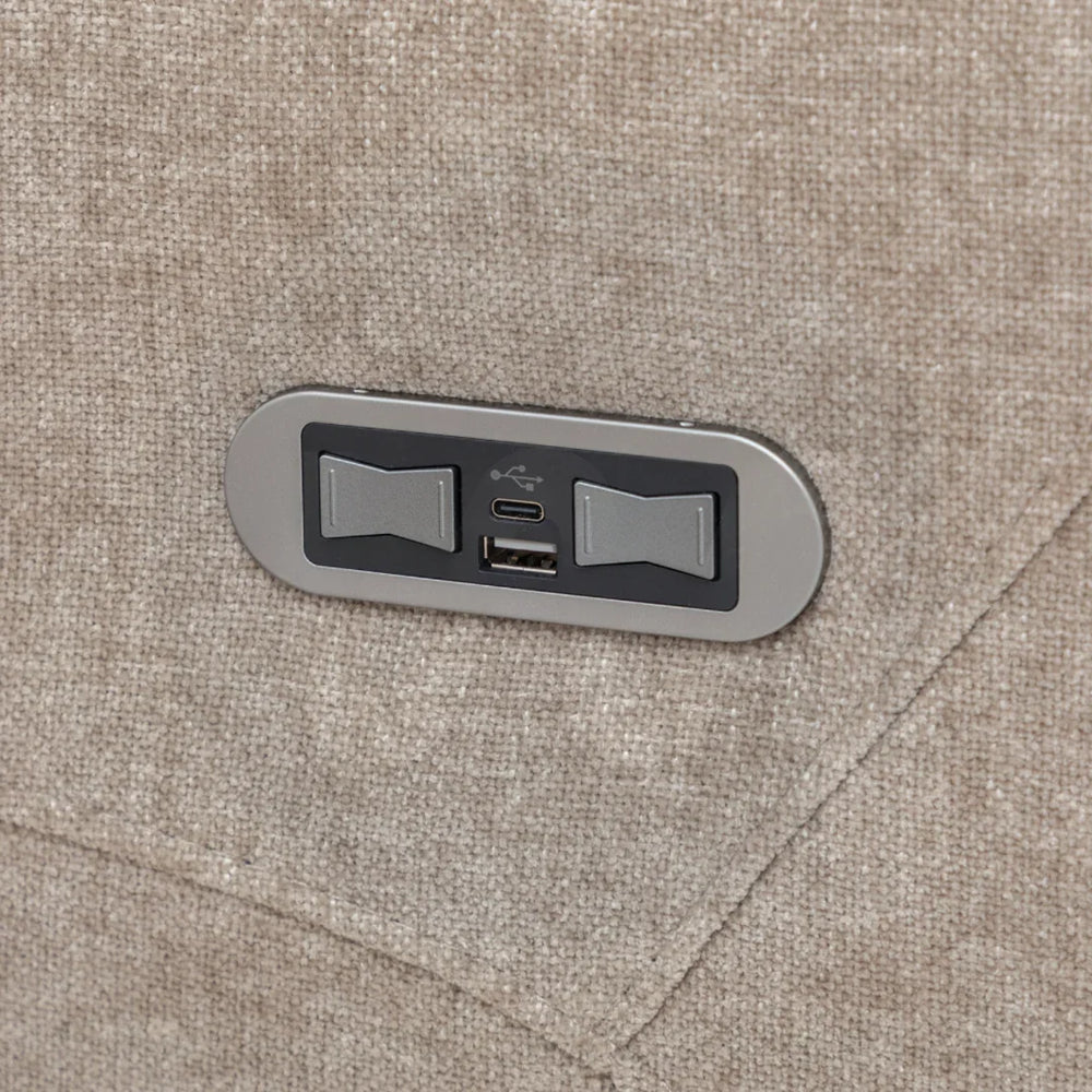 Close-up of beige fabric sofa arm with built-in USB and USB-C charging ports