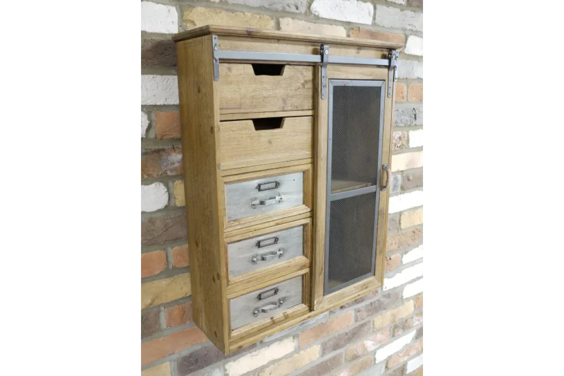 Rustic wooden wall cabinet with metal drawers and mesh door mounted on brick wall