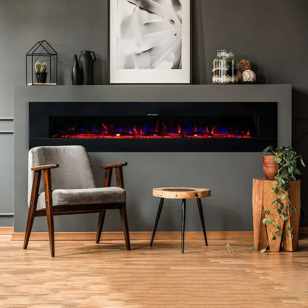 Modern electric fireplace in grey wall with wooden accent chair and side table